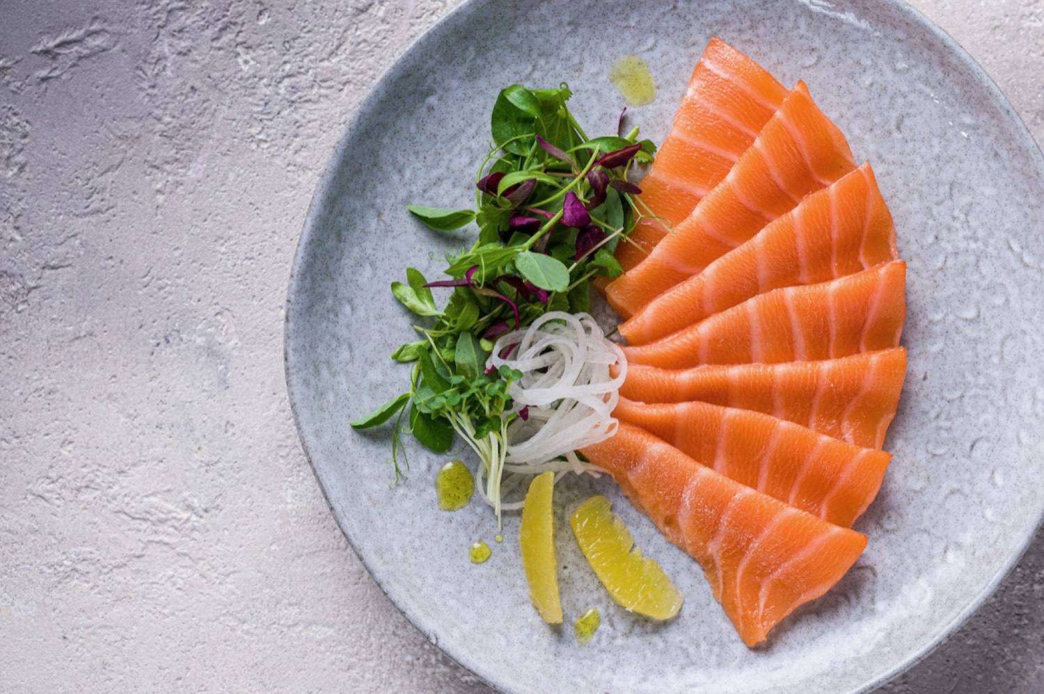 Sliced salmon served on a plate